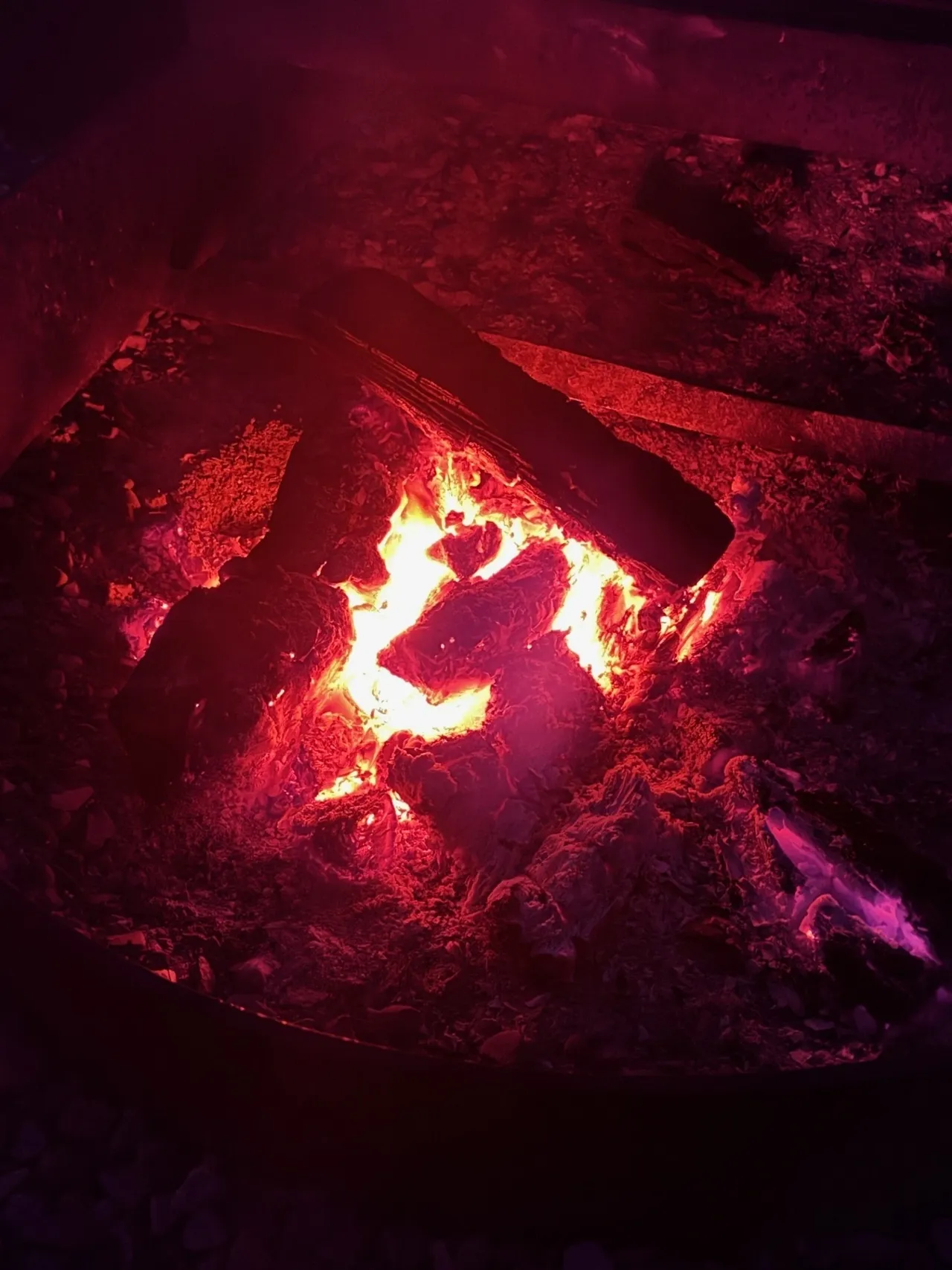 A fire is burning in the dark.