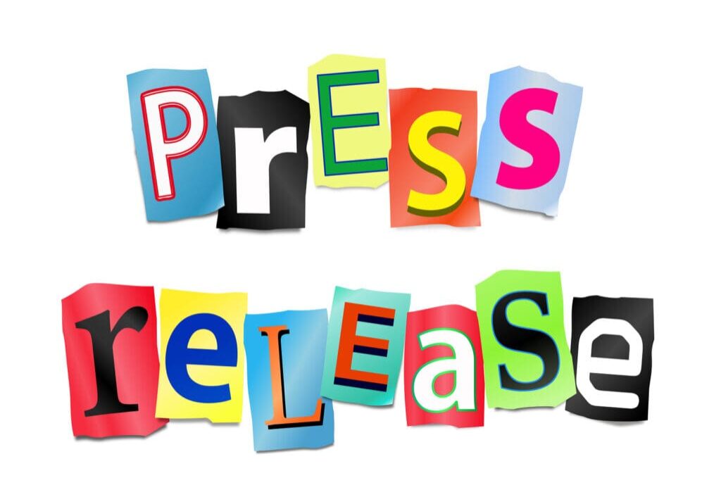 Illustration depicting cut out letters arranged to form the words press release.